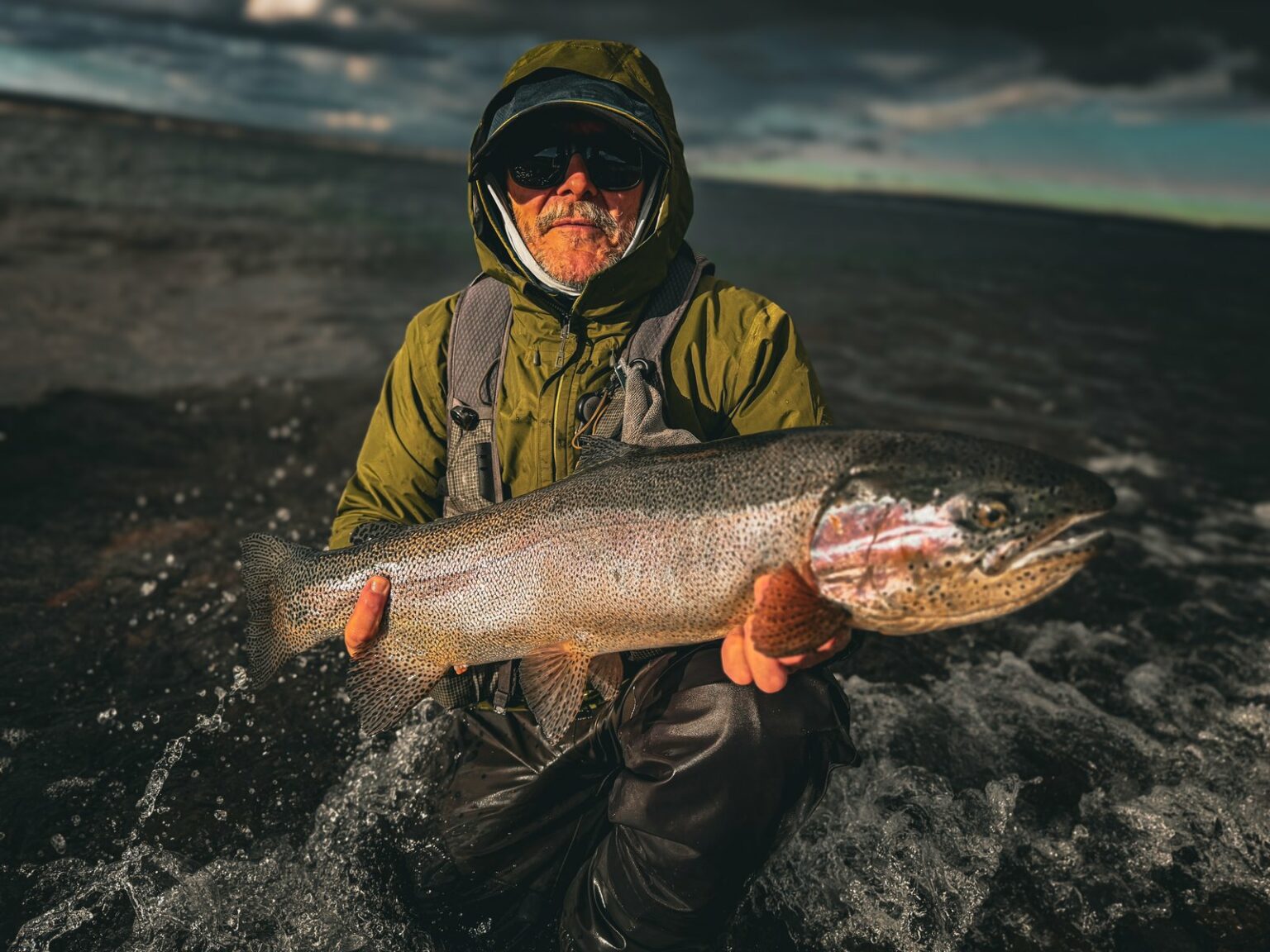 Angler and rainbow trout in the Santa Cruz steppe, Jurassic Lake